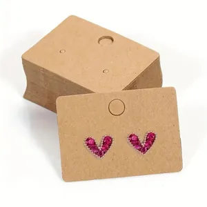 Kraft paper earring display cards shown with pink heart stud earrings and stack detail