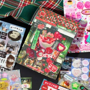Close-up detail of romantic girl theme stickers with strawberry and dessert patterns.