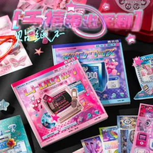 Close-up of retro Y2K style sticker books with vibrant pink and blue electronic patterns