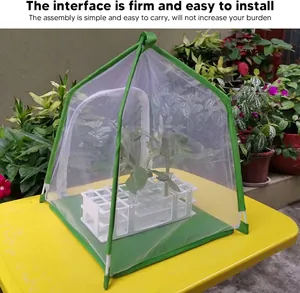 Macro detail of the portable green foldable mesh insect and butterfly observation habitat cage