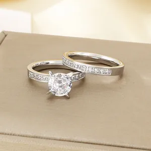 Elegant silver stainless steel wedding ring set with sparkling round four-prong zircon stones