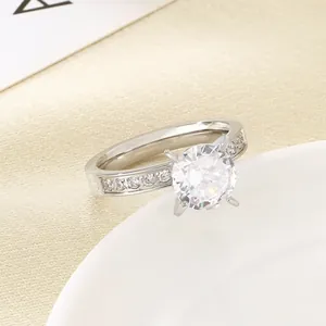 Close-up of a elegant silver stainless steel ring with a four-prong set round zircon