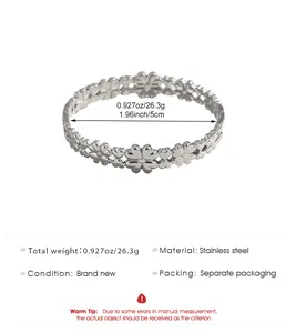 Detailed view of stainless steel flower and heart bangle including size and weight info