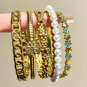 Detailed view of gold-plated stainless steel bracelet set with pearls and crystals for women