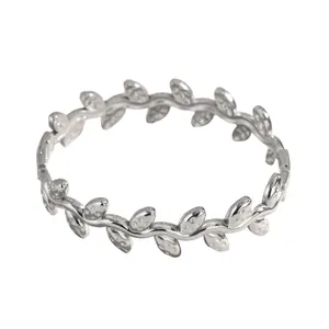 Detailed view of elegant silver stainless steel bangle with vine leaf pattern.