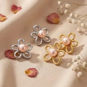 Detailed macro shot of French retro style flower stud earrings with pink pearl centers