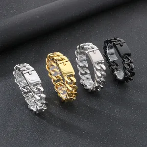 Detail of chunky titanium steel curb chain bracelets in silver, gold, and black finishes.