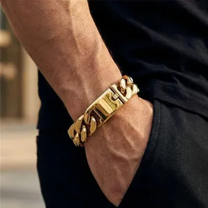 Close-up of a men's bold polished gold titanium steel chunky chain bracelet