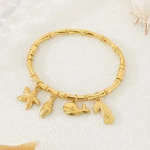18k gold plated stainless steel bamboo joint bracelet featuring sea theme ocean charms