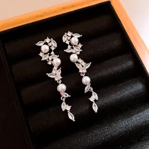 Vintage silver tassel clip-on earrings with shimmering zircons and elegant white pearls
