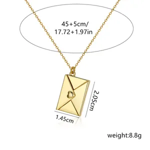 Macro view of gold stainless steel heart envelope pendant showing exact dimensions