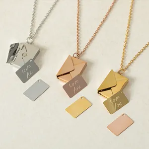 Detailed view of stainless steel envelope necklaces with 'Love You' engraved cards.