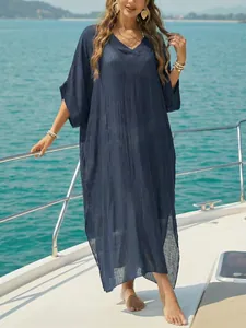 Women's loose navy blue V-neck beach cover-up maxi dress with side slits.