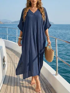 Elegant side slit detail on a navy blue V-neck loose summer beach cover-up dress