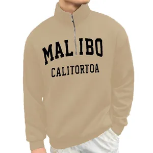 Close-up of men's vintage half-zip sweatshirt with stand collar and graphic print