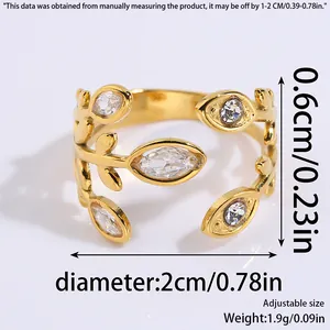 Adjustable stainless steel ring with elegant gold-plated wheat ear design and cubic zirconia.
