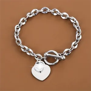 Elegant stainless steel heart charm bracelet with toggle clasp and rhinestone detail