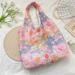 Detailed view of ethereal pink floral lace tote bag with unique textured fuzzy finish