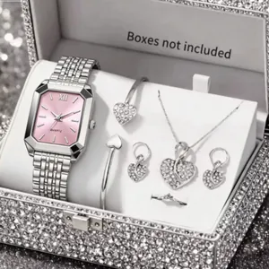 Detailed view of a silver-tone women's quartz watch with a pink dial and matching jewelry set.