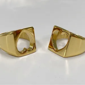 Minimalist gold stainless steel ring featuring a stylish hollow heart design