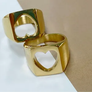 Elegant golden stainless steel rings featuring a minimalist heart cutout on square face