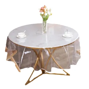 Clear round PVC tablecloth with white overlocked stitched edges for dining table protection