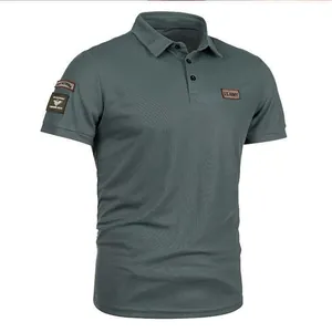 Detailed view of dark grey men's tactical polo shirt featuring U.S. Army chest patch