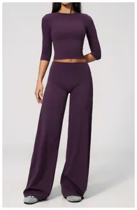 Detail view of purple brushed wide-leg yoga pants and crop top set