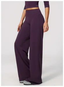 Close-up of high-waisted purple wide-leg yoga pants for athletic and casual wear