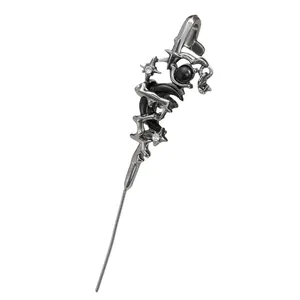 Macro view of dark gothic style snake ear cuff with black stone and star details
