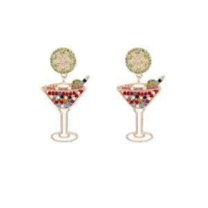 Pair of colorful rhinestone cocktail glass earrings with lemon slice detail in gold finish