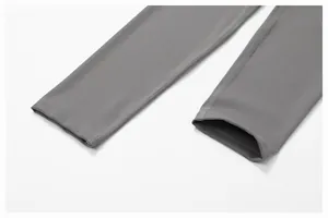 Close-up detail of gray yoga pants leg openings with professional flatlock stitching