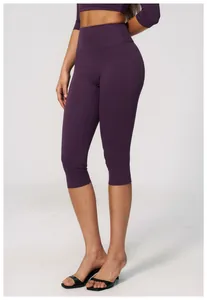 Close-up of purple high-waisted yoga capris for fitness and running