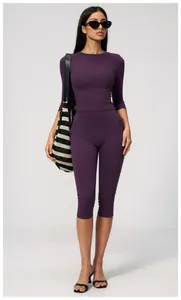 Professional high-waist brushed yoga set featuring mid-length leggings shown on model
