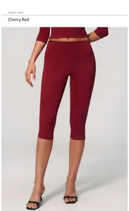 Detail view of high-waist cherry red yoga capris for women, slim fit athletic leggings