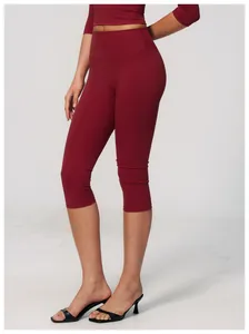 Close-up of high-waist red cropped yoga pants with brushed texture for sporty women