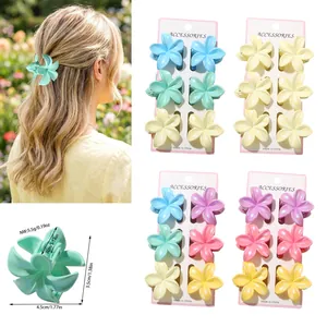 Detail showing multi-colored Plumeria flower hair claw clips with size dimensions