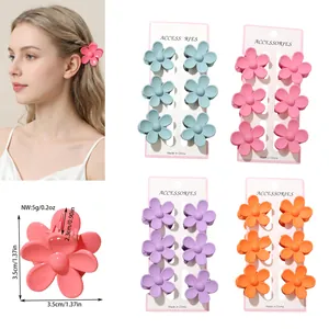 Close-up of colorful plumeria flower hair claw clips with size and weight details