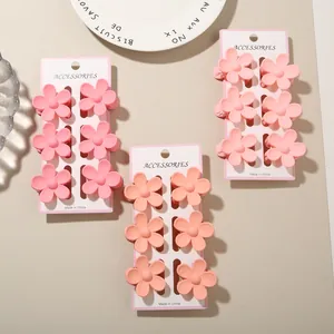 Set of elegant matte pink and peach plumeria flower hair clips on white display cards