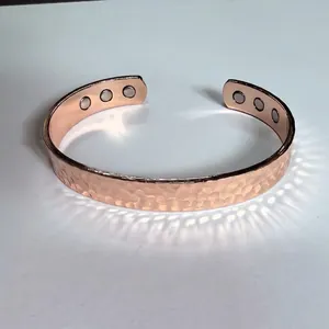 Rose gold magnetic pure copper cuff bracelet with decorative hammered texture, 10mm width