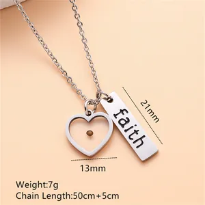 Detailed view of stainless steel mustard seed heart and faith engraved bar necklace