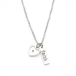 Stainless steel necklace featuring a heart pendant with mustard seed and faith engraving