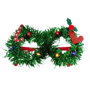 Festive Christmas party glasses decorated with green tinsel and holiday charms.