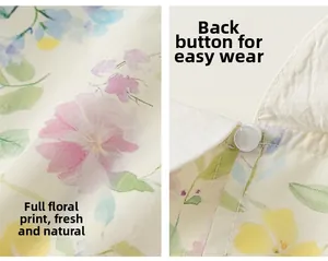 Détail du tissu à imprimé floral et de la fermeture à bouton au dos de la robe fille