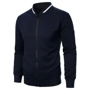 Detailed view of navy blue men's jacquard bomber jacket with textured pattern
