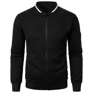 Detail view of black men's zip-up jacket featuring premium textured jacquard pattern