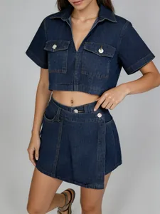 Detailed close-up of a stylish women's denim two-piece set with V-neck crop top