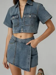 Detail showing the fabric and cut of a stylish two-piece blue denim set with V-neck top