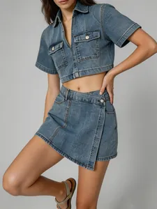 Chic denim two-piece set featuring a cropped short-sleeve shirt and asymmetrical mini skirt.