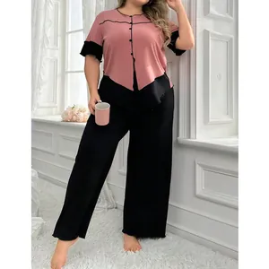 Ensemble pyjama grande taille rose et noir avec pantalon large pour un look cosy